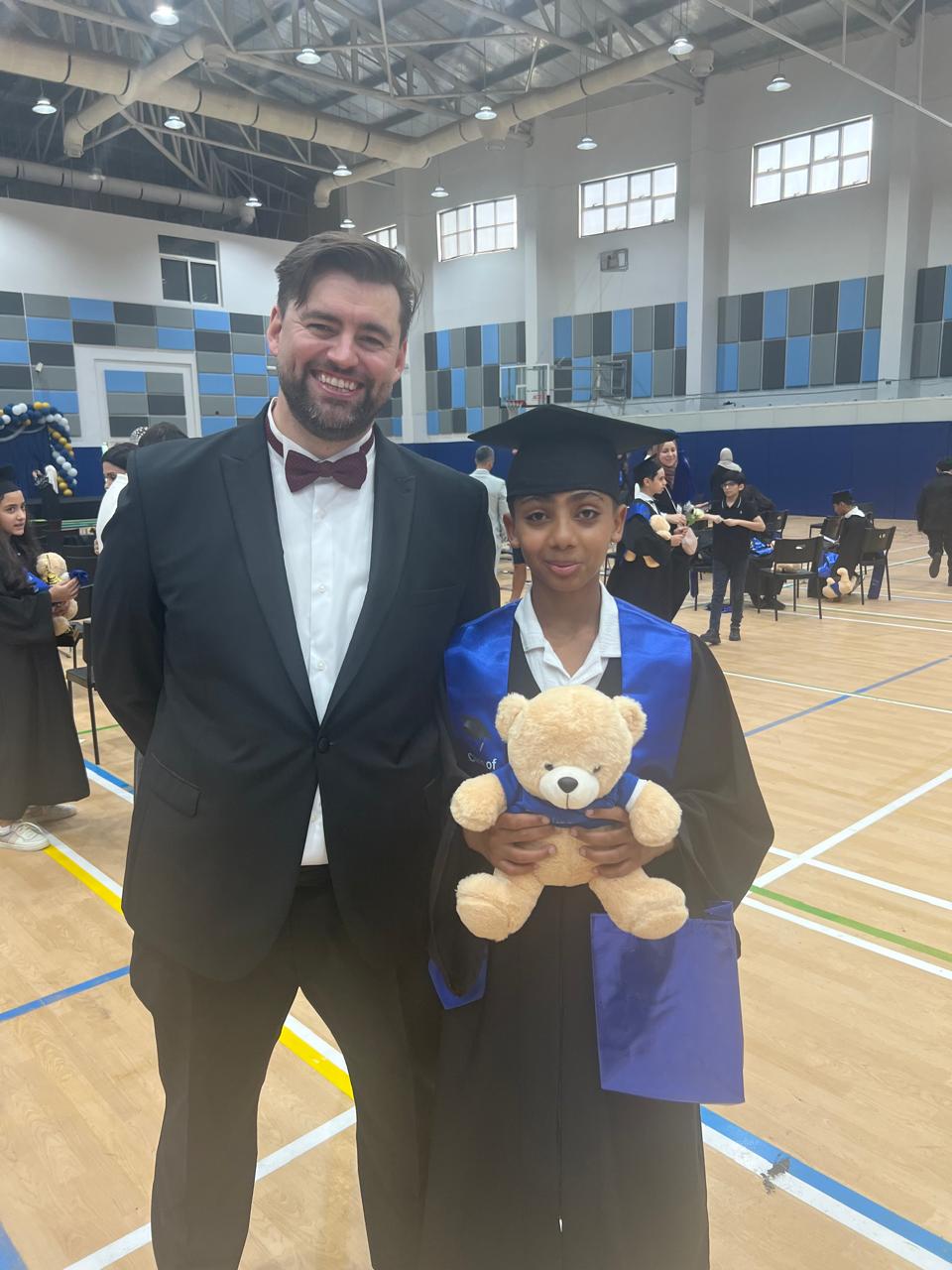 Sami in cap and gown at his graduation